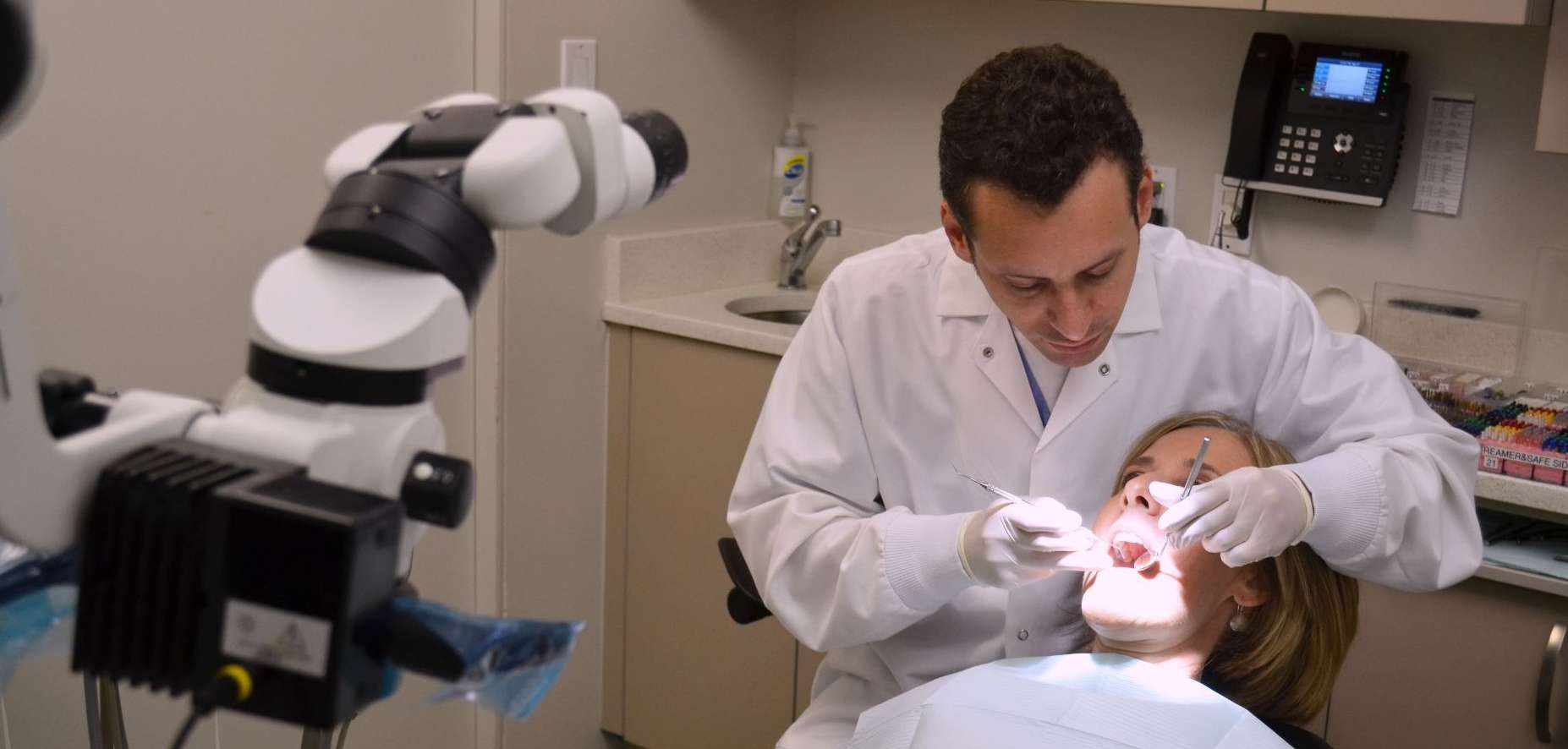 Endodontist inspecting teeth